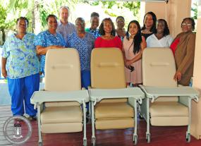 The management and staff of the Adina Donovan Home posed with managers from CIL and Real Legacy Trust next to the newly donated recliners.